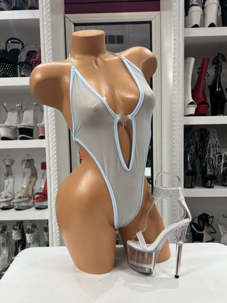 Baby Blue Mesh Romper with sheer stretch fabric, crystal center accent, plunging neckline, and dramatic side cutouts displayed on mannequin.