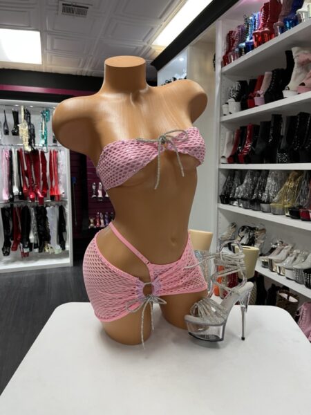 Pink Fishnet Set with rhinestone bandeau top, matching fishnet mini skirt, and sparkling rhinestone cord details.