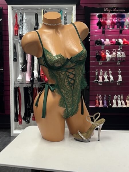 Emerald Lace Teddy featuring sheer floral lace, underwire cups, lace-up front detailing, adjustable straps, and satin ribbon side ties displayed on a mannequin.