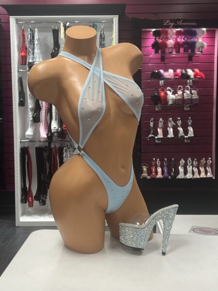 Sky Crossed Romper featuring a crossed halter neckline, sheer mesh panels, sparkling crystal embellishments, and baby blue stretch fabric.
