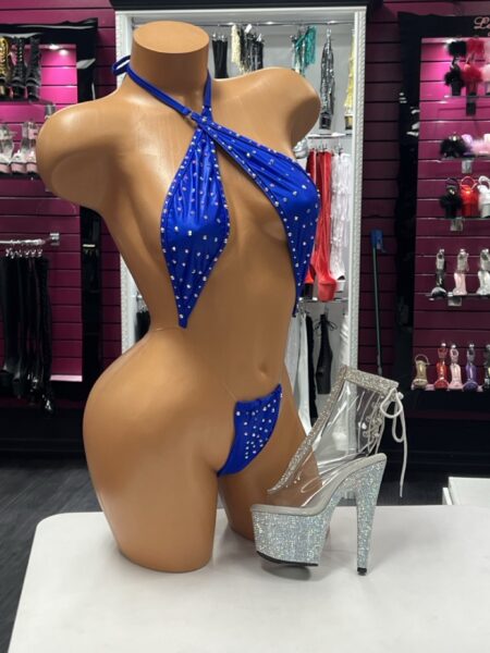 Royal Crystal Slingshot with wrap halter neckline, sparkling crystal embellishments, royal blue stretch fabric, and dramatic open-front design.