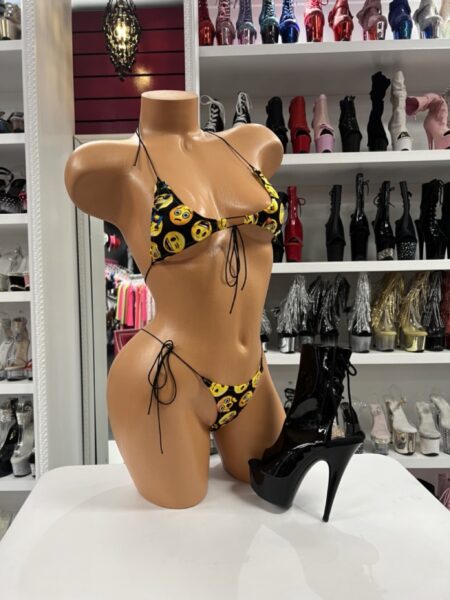 Bring playful energy to your next adventure with this Emoji Bikini featuring adjustable string ties, a fun emoji print, and soft stretch fabric for the perfect summer look.