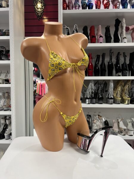 Yellow Bandana Bikini with paisley print, adjustable triangle top, side-tie bottoms, and soft stretch fabric displayed on mannequin.