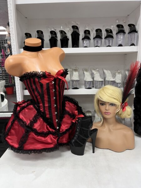 Dancehall Darling Costume Set with red and black corset-style dress, ruffled skirt, bloomer shorts, choker, and feathered headpiece.