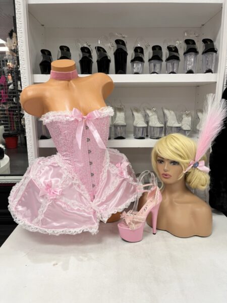 Madame Marie Costume Set with pink corset-style dress, white lace and bows, bloomer shorts, matching choker, and decorative headpiece.