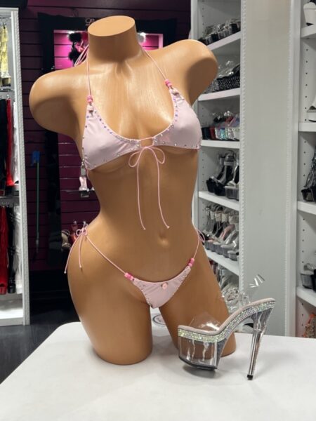 Baby Pink Rhinestone Bikini featuring rhinestone trim, floral appliqués, adjustable triangle halter top, and matching side-tie thong bottoms.
