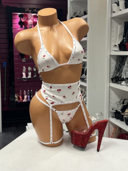 Cherry Rhinestone Set featuring a white ribbed halter bra, matching thong, high-waisted garter belt, sparkling rhinestone trim, and playful cherry print.