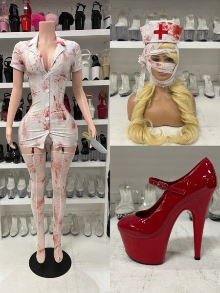 Silent Care Nurse Costume by Forplay featuring a white blood-splatter mini dress, matching nurse hat, bandaged headwrap, garter panty, thigh-high socks, and costume knife.
