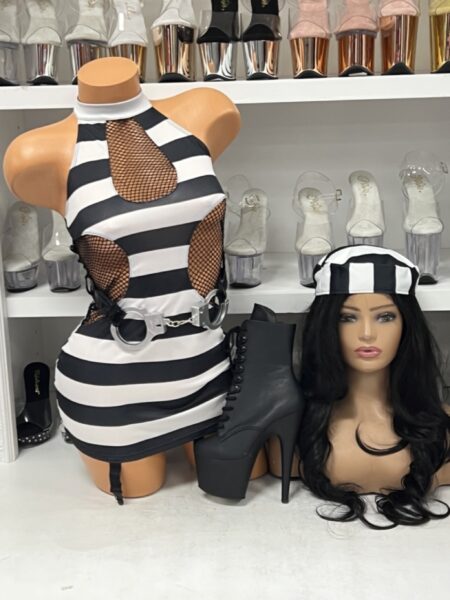 Jail Birdie costume with black and white striped dress, fishnet cutouts, attached garters, matching cap, and handcuff belt.