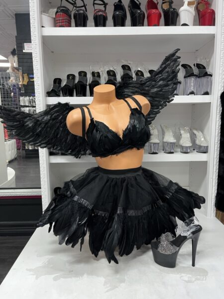 Naughty Angel Costume four-piece Halloween outfit with feathered black bra top, layered skirt, matching shorts, and large black angel wings.