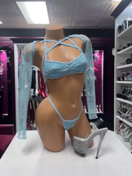 Light blue fishnet lingerie set with rhinestone trim, long sleeves, strappy neckline, and high-cut bottom.