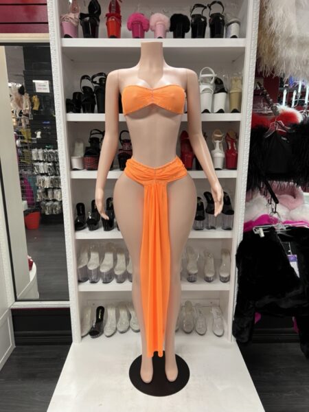 Neon Orange Skirt Set featuring a bandeau top with a matching gathered skirt bottom and dramatic flowing front drape.