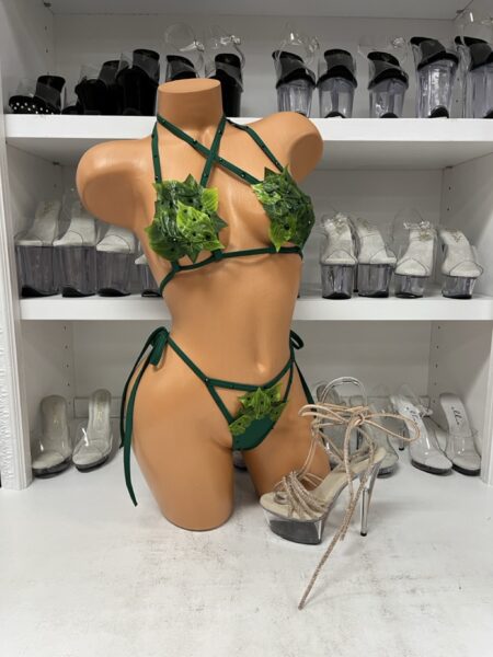 Poison Ivy Green Leaf Bikini Set featuring a dark green strappy bikini top with layered green ivy leaves, black rhinestone accents, crisscross neckline, and matching tie-side thong bottom with leaf decorations.