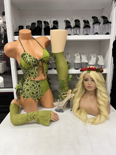 Handle With Care 6PC Costume Set featuring a green ivy-patterned lace-up bodysuit, matching green accessories, and woodland-inspired styling.