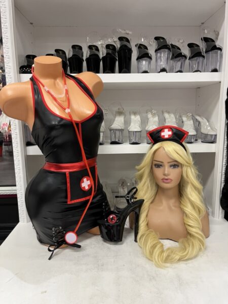 Surgical Assistant Nurse Costume featuring a black wet-look mini dress with red trim, lace-up details, nurse headband, and stethoscope.