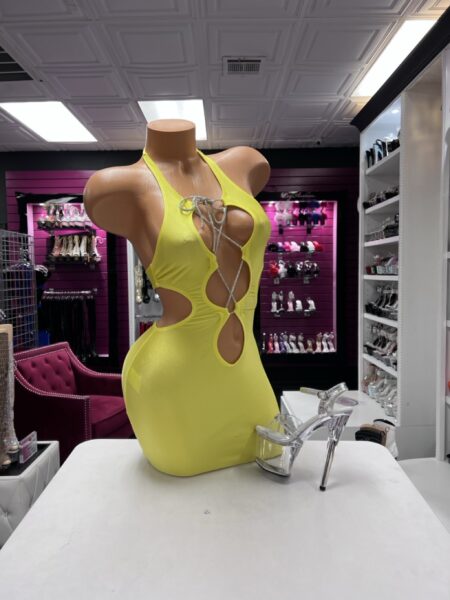 Lime Crystal Cutout Dress featuring bright lime fabric, a halter neckline, dramatic waist openings, and sparkling crystal lace-up details.