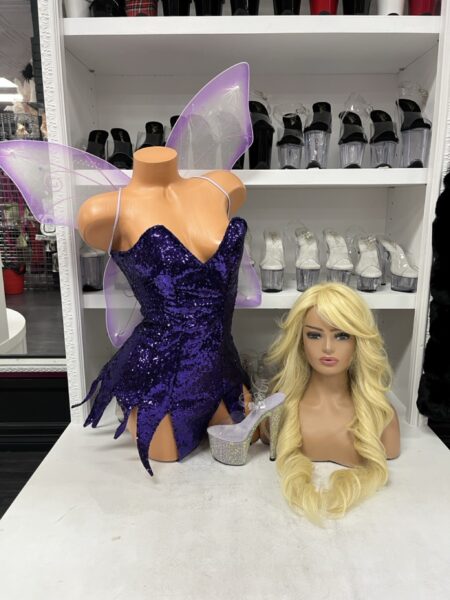 Purple Sequin Fairy costume featuring a deep purple sequin mini dress with a sweetheart neckline, pointed fairy hemline, and sheer lavender wings.