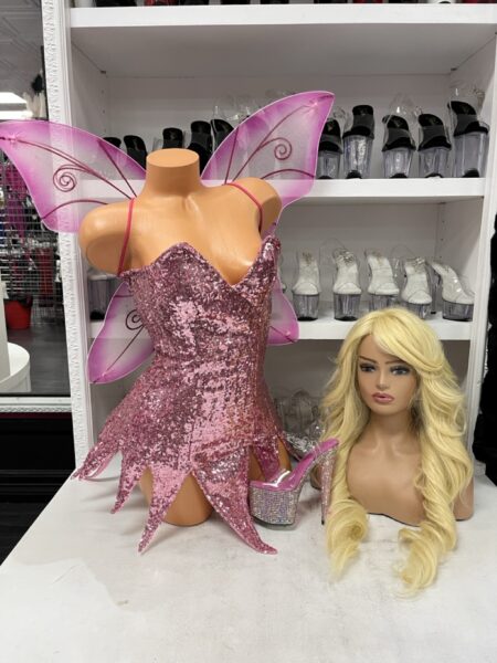 Pink Sequin Fairy costume featuring a sparkling pink sequin mini dress with a sweetheart neckline, pointed fairy hemline, and sheer pink butterfly wings.
