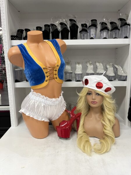 Bonus Level Mushroom Costume featuring a royal blue velvet crop vest with yellow trim, lace-up front, white satin ruffled shorts, and a mushroom hat.