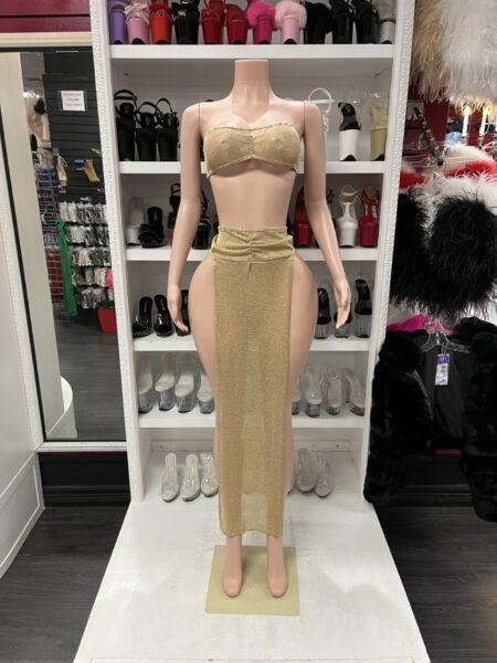 Gold Shimmer Skirt Set featuring a sparkling gold strapless bandeau crop top and matching high-waisted long skirt with dramatic open sides.