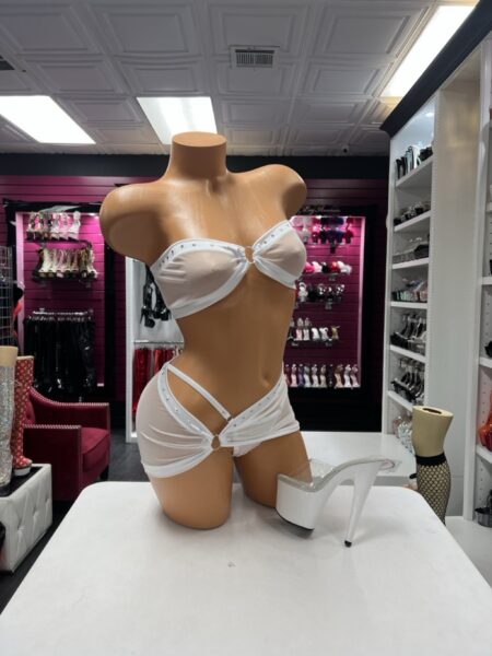 White Crystal Cutout Set featuring a strapless white bandeau top with rhinestone accents, a center ring, and a matching asymmetrical mini skirt with a hip cutout.