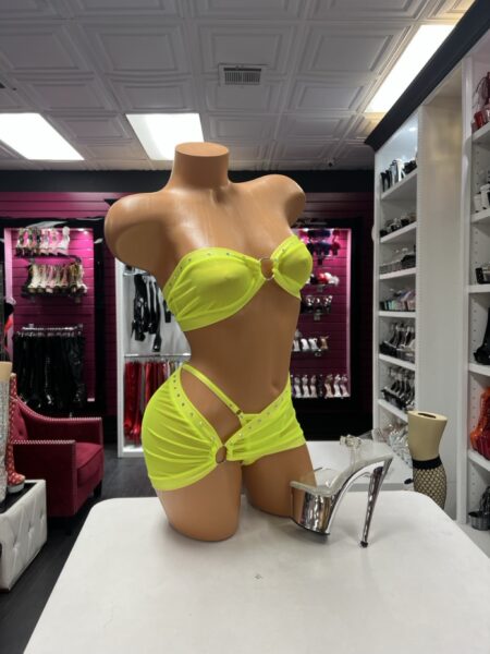 Lime Crystal Bandeau Set featuring a bright lime green strapless bandeau top with a center metal ring, sparkling rhinestone trim, and matching gathered mini skirt with an open hip cutout.