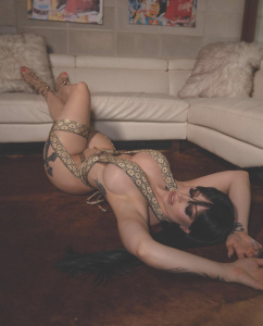 model on rug wearing designer heels and gucci print dancewear from pleasure zone online